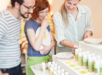Corporate party in Cologne – a team painting ceramics at pottery art café